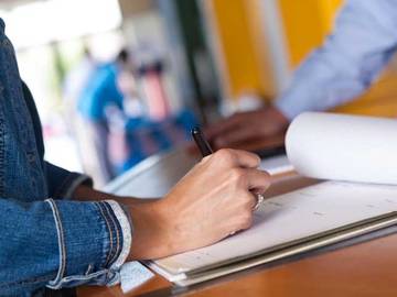 woman filling out voter registration